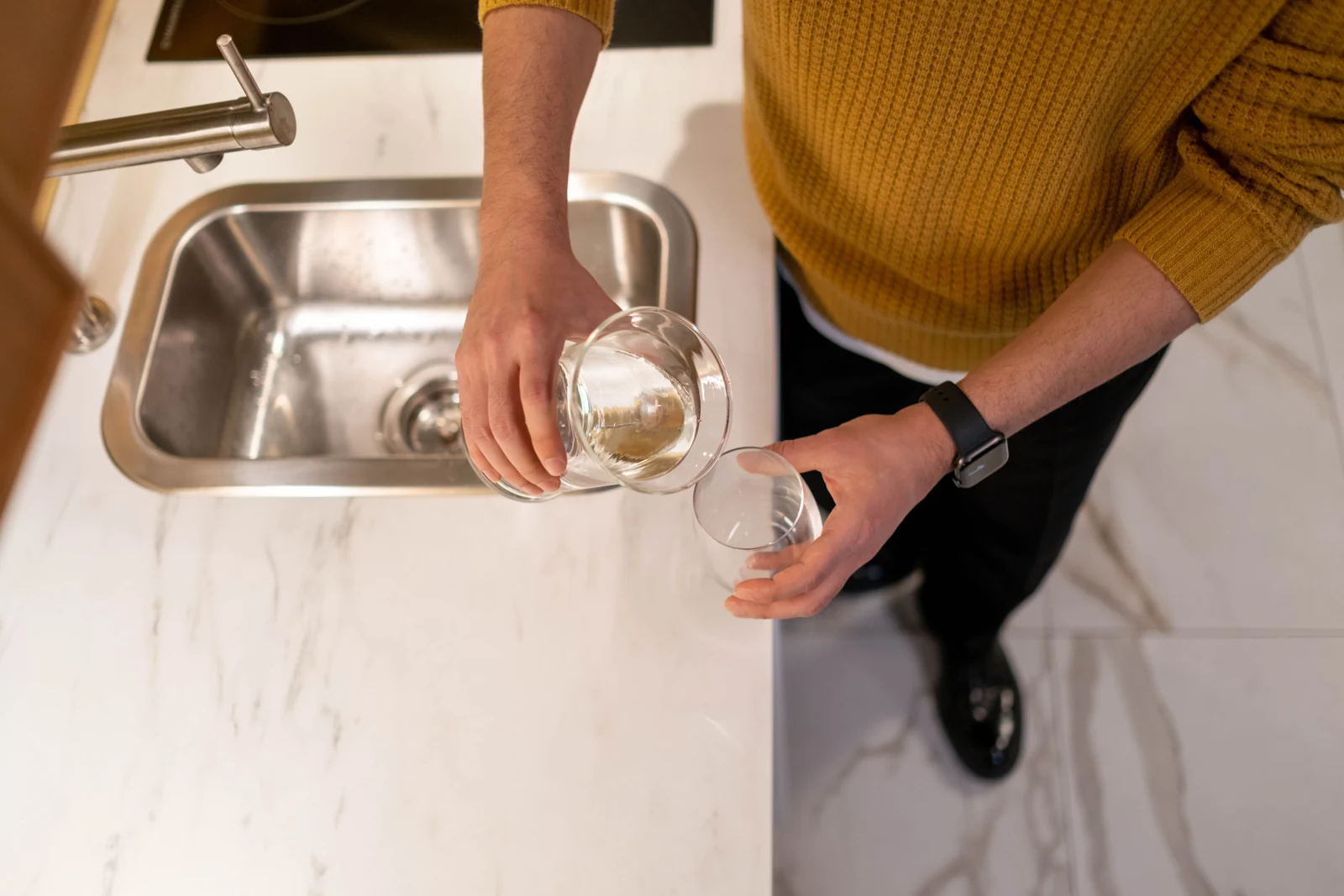 Water being poured into a drinking glass